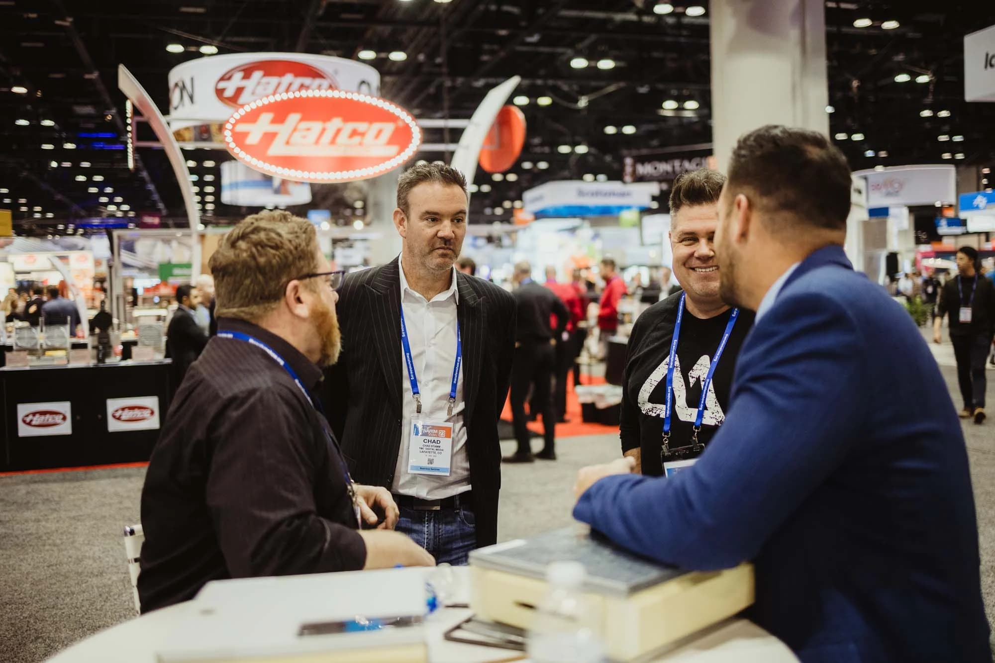 Chad Stamm meeting with clients at the NAFEM Show